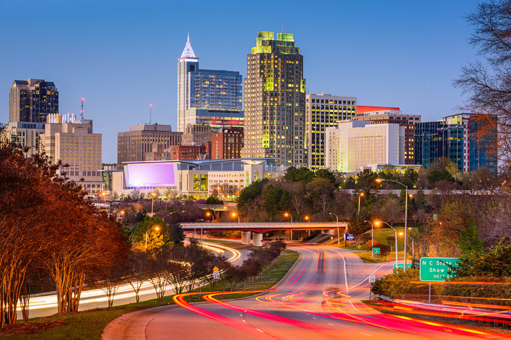 View of the Raleigh North Carolina downtown skyline at night with streaking lights